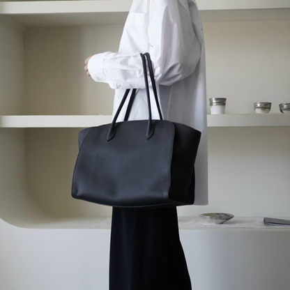 Jet Black Pebbled Grain Flared Side Large Tote With Dual Pairs Elongated Carry Loops, Pointed Stitched Tab Fixtures And Spacious Open Inner Storage Cavity
