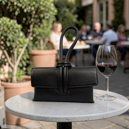 Grain Rectangular Wrist Clutch With Sculptural Knotted Loop Handle And Full Overlay Flap Closure
