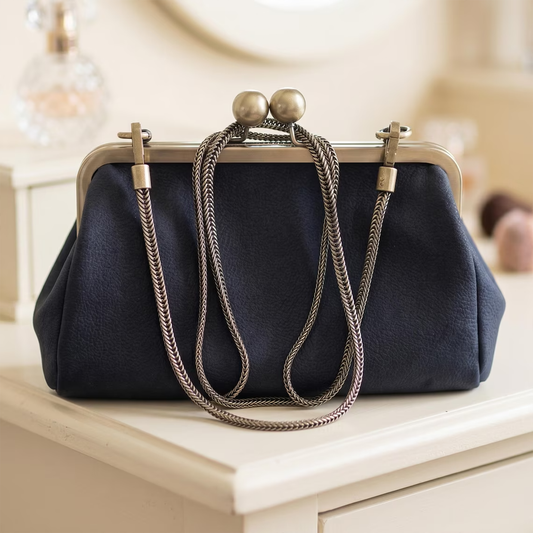 Navy Matte Pebbled Vintage Kiss-Lock Clutch With Bronze Dual Ball Frame Hardware, Woven Metal Cord Strand And Bright Contrast Inner Lining